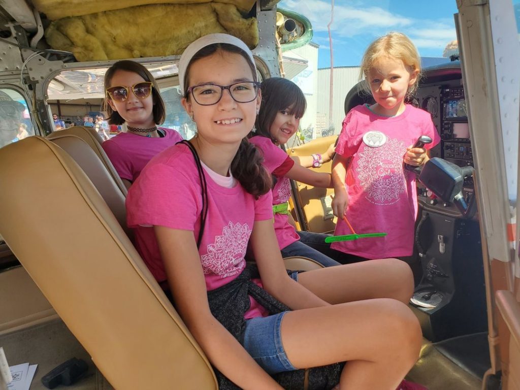 Young Girls in Helicopter Oklahoma City Women in Aviation International